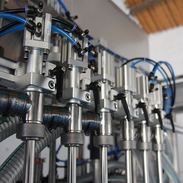 máy làm đầy chai dầu ô liu